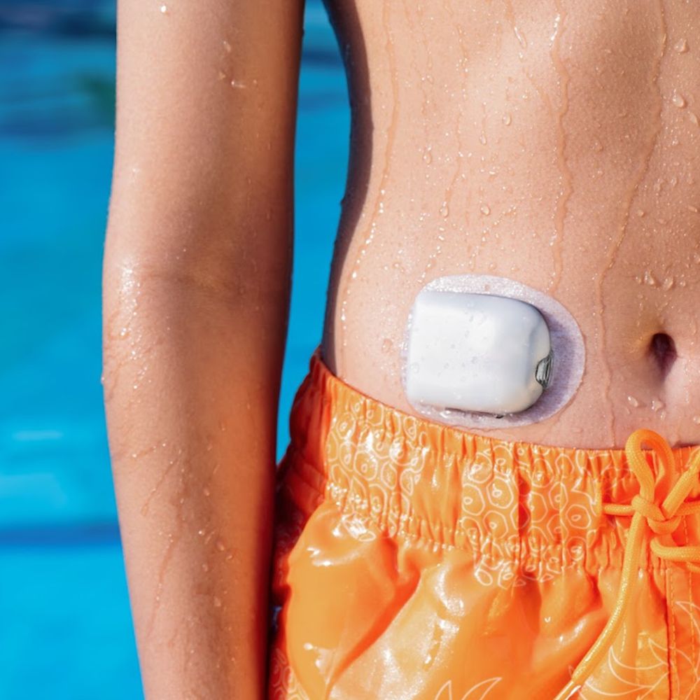 Close-up of an Omnipod pod worn while swimming – diabetes technology marketing UAE